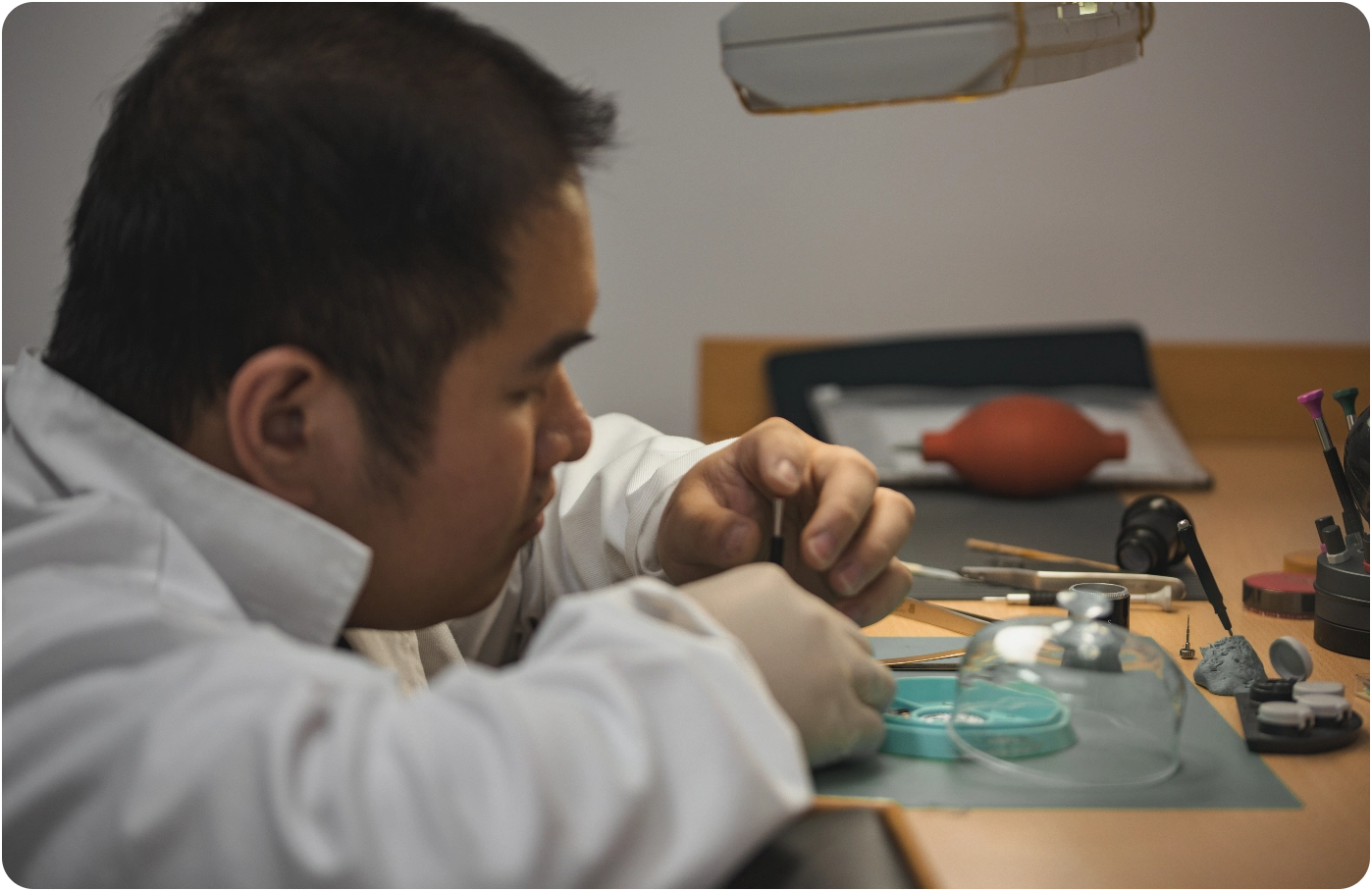 Technician inspecting watch